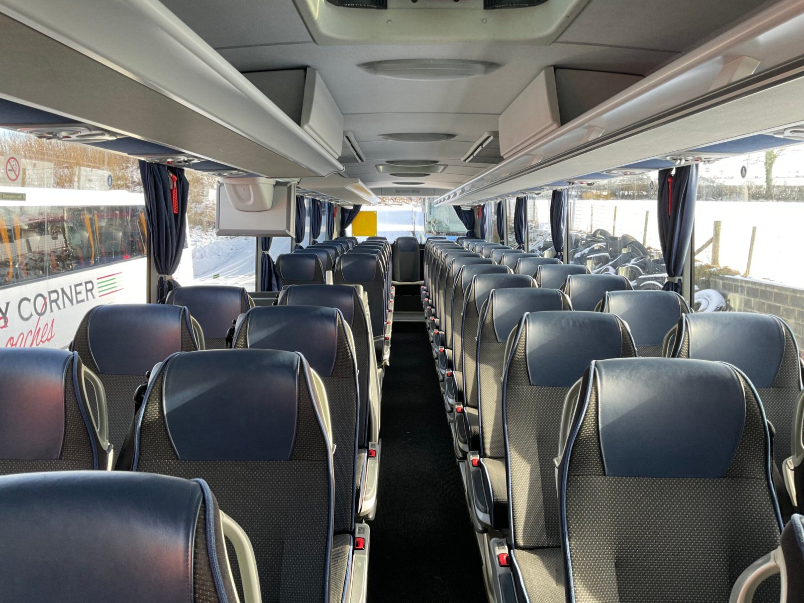 Passengers boarding a Windy Corner coach
